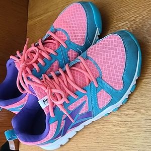 Bright pink Reebok tennis shoes